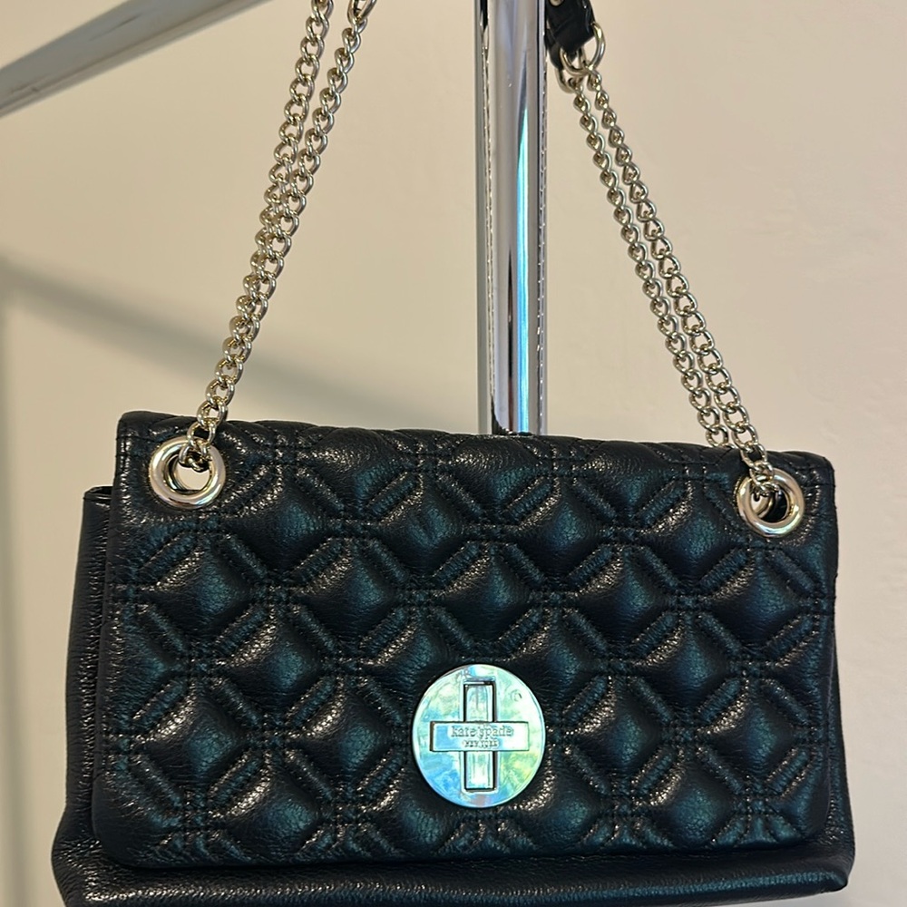 Brand: Kate Spade
Color: black
Material: faux leather 
Features: gold toned
